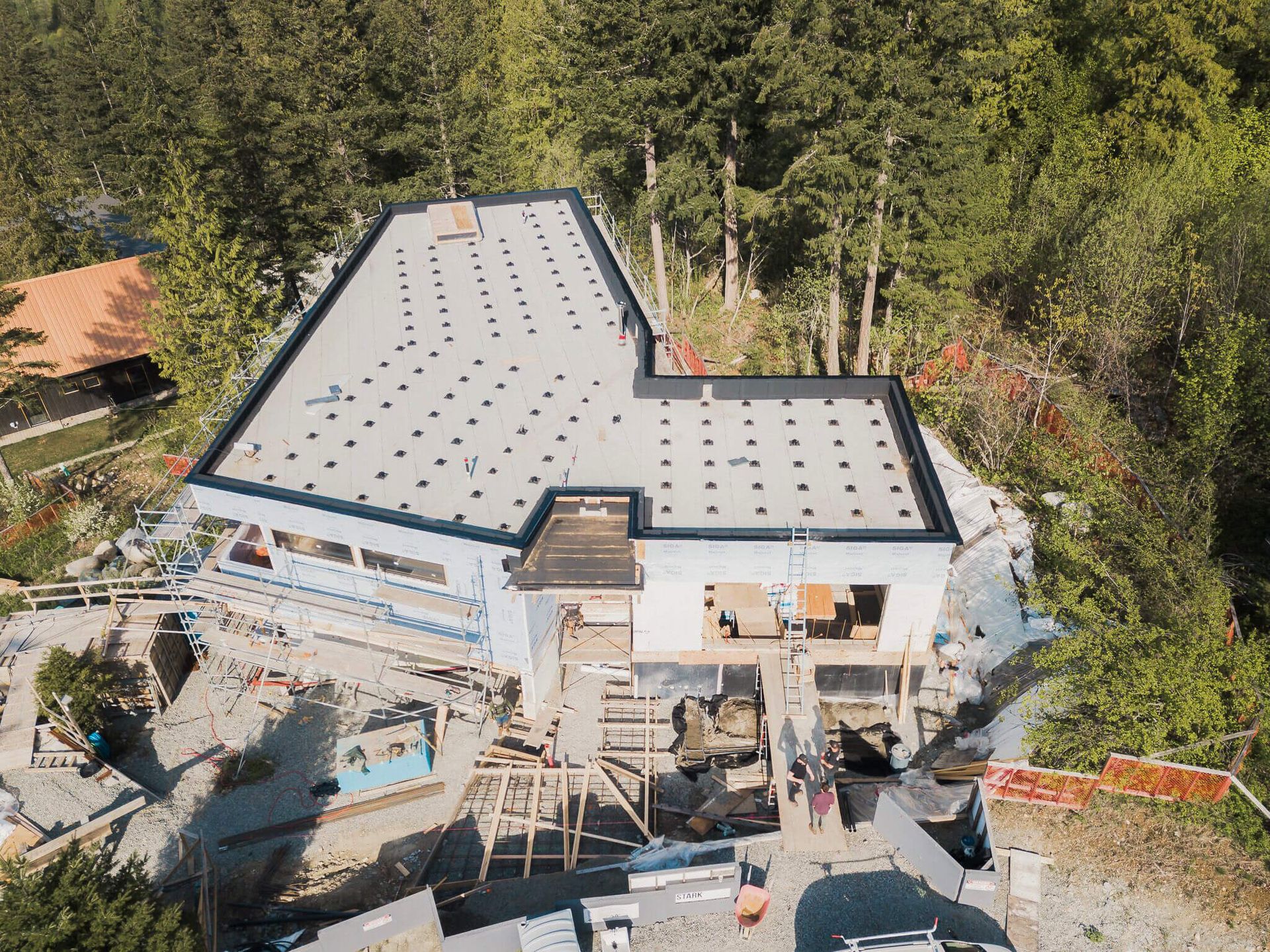 aerial view of passive house in the forest